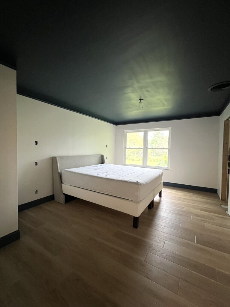 primary Suite Remodel, Moody Bedroom, Painted ceiling, LVP Flooring, Contrast Trim, King Bed